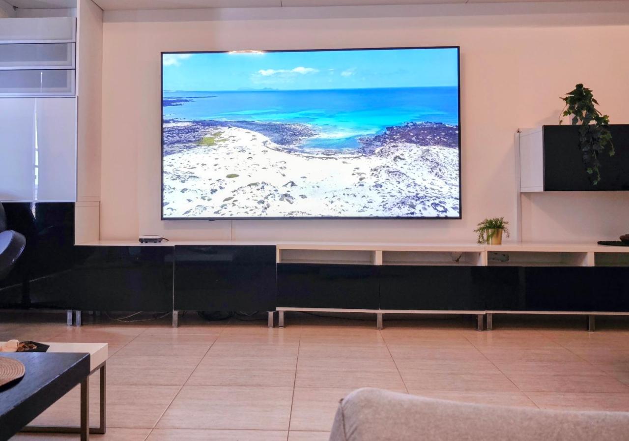 86-inch cinema TV in the living room of Casa Los Alisios in Costa Teguise