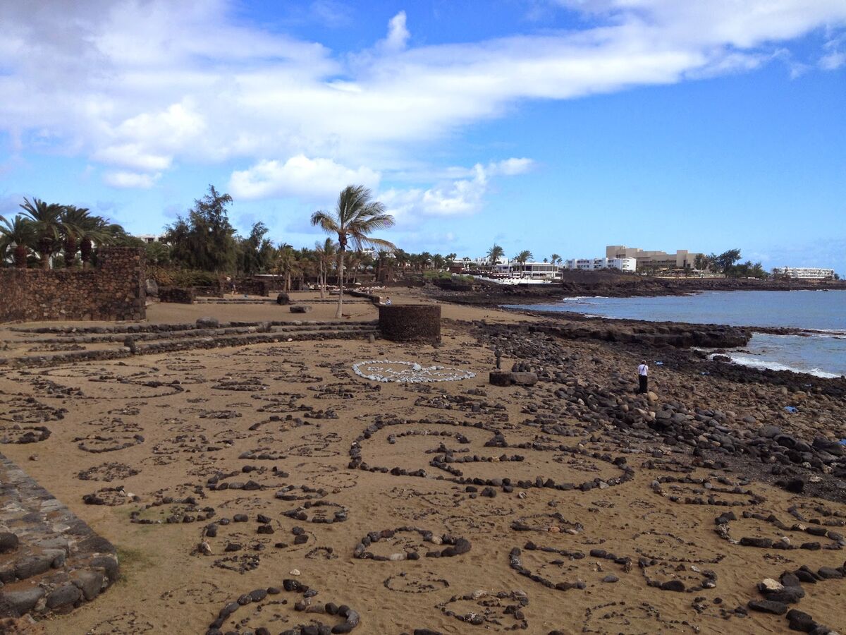 Playa Bastián rocky shore and rock art in Costa Teguise