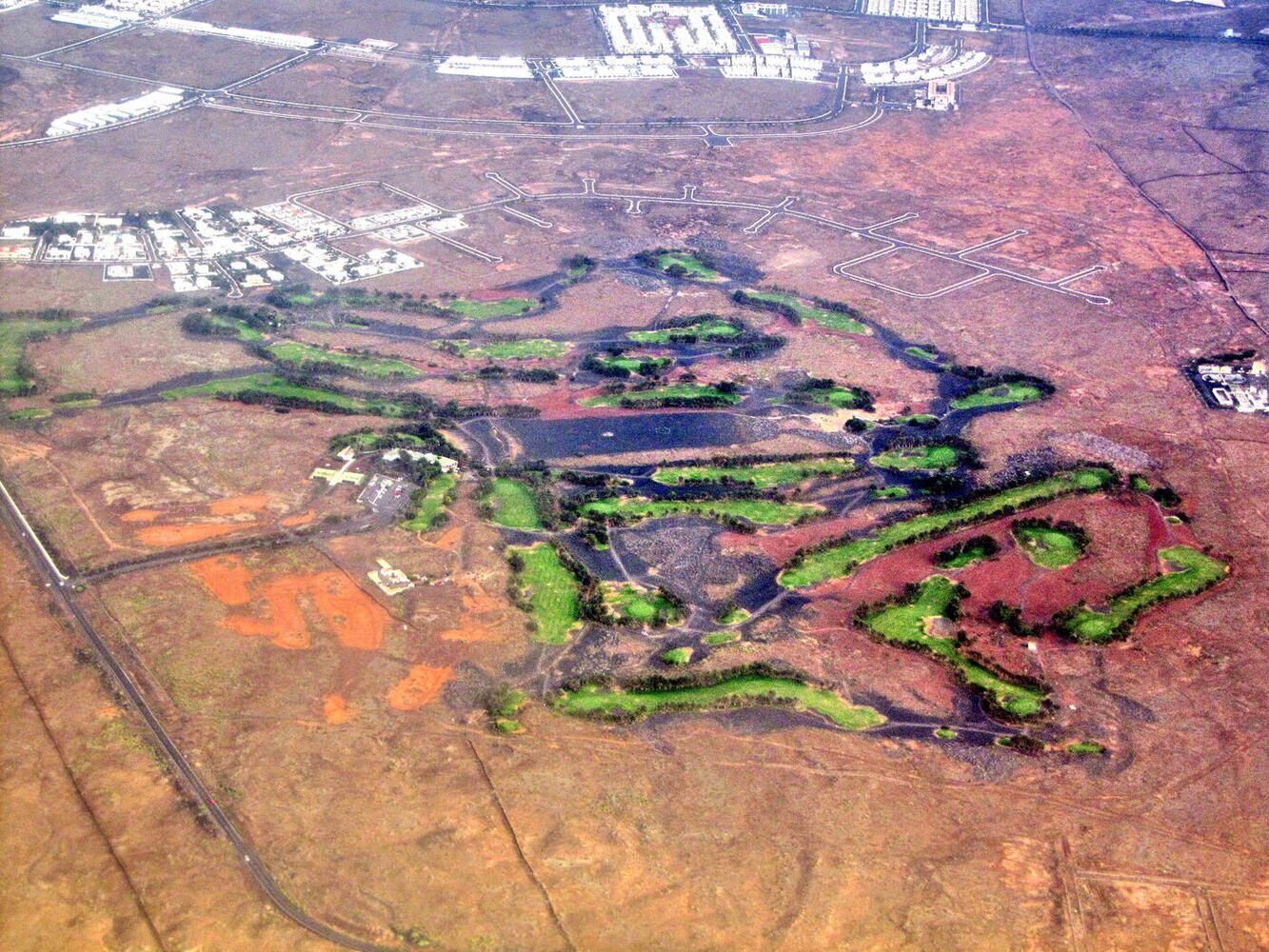 Costa Teguise Golf course with palm trees and volcanic backdrop, Lanzarote