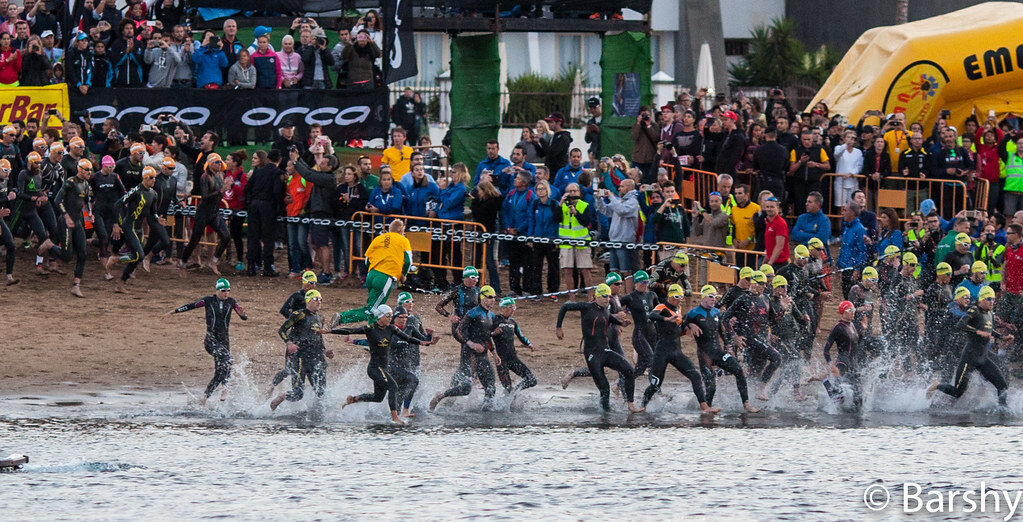 Athletes running into the water at the Ironman Lanzarote swim start, Playa Grande Puerto del Carmen