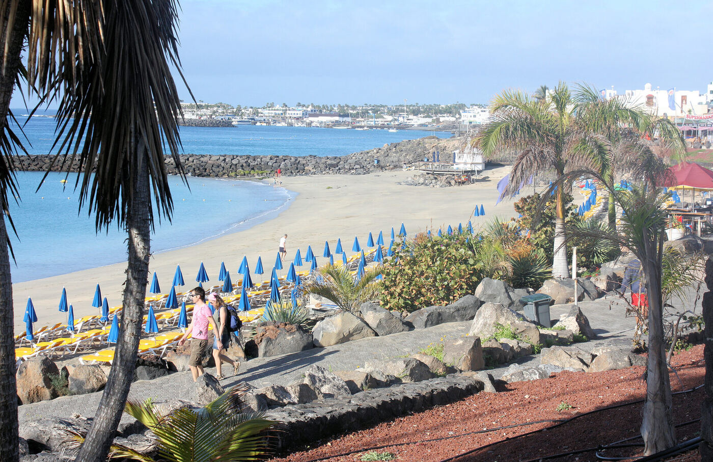 Playa Dorada beach in Playa Blanca, Lanzarote, with sandy shoreline and protected calm water suitable for families