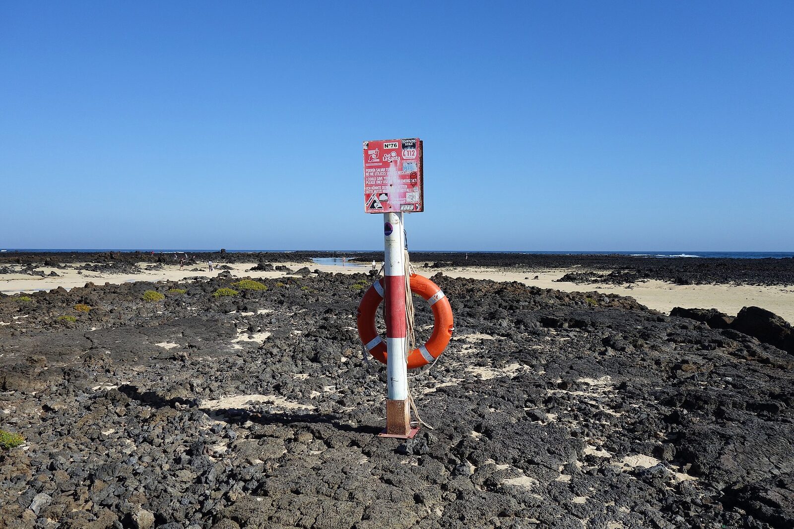 Caletón Blanco near Órzola, white sand lagoons set against black volcanic rock in northern Lanzarote
