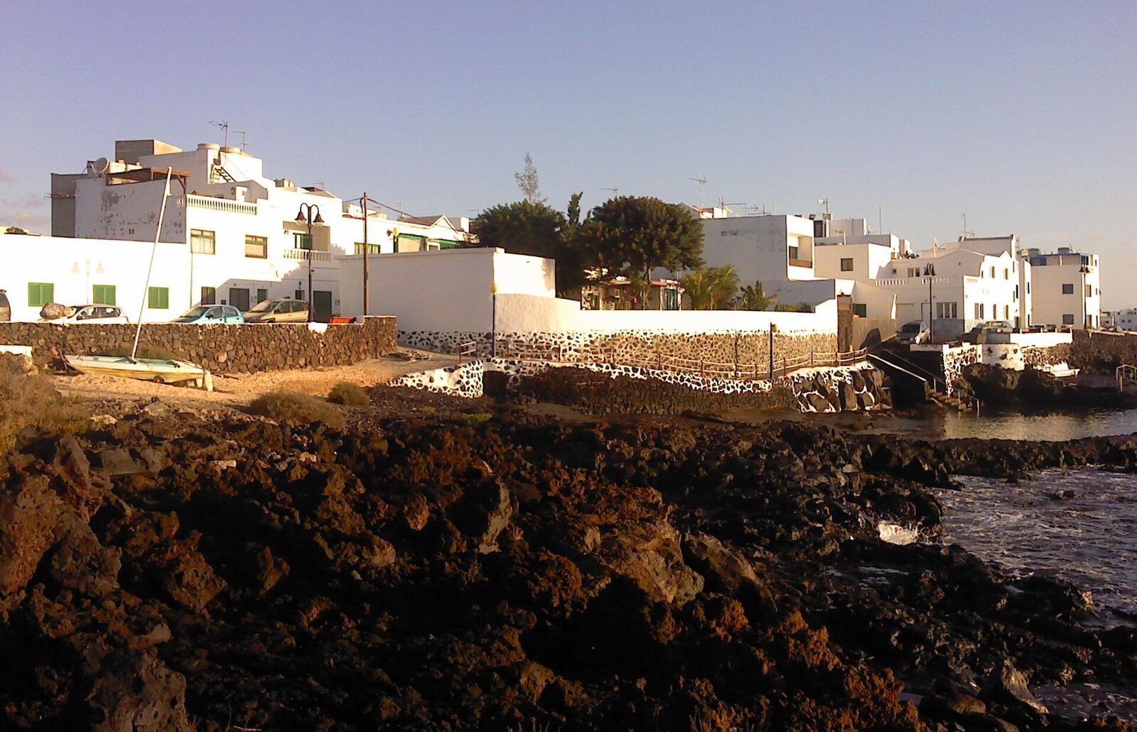 Natural volcanic pools at Punta Mujeres on Lanzarote's north coast, walled in by villagers to block the swell