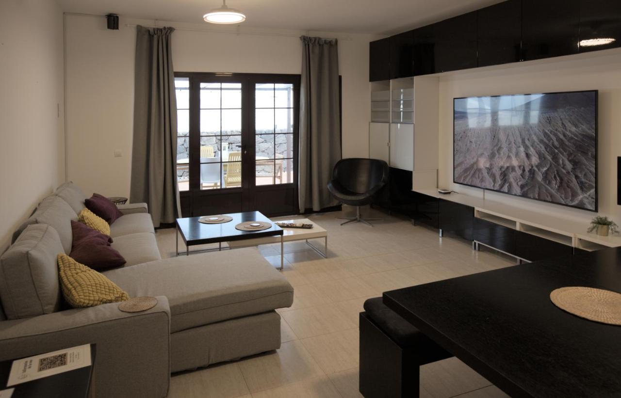 Spacious living room with 86-inch cinema TV